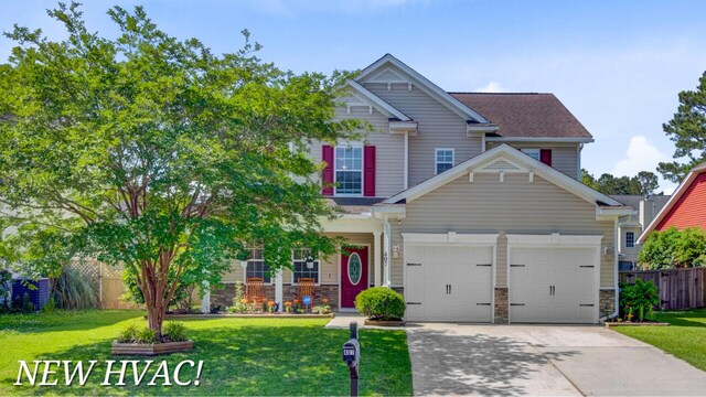 407 Glenmore Dr, Moncks Corner, SC 29461 - craftsman-style house featuring a garage, concrete driveway, and stone siding