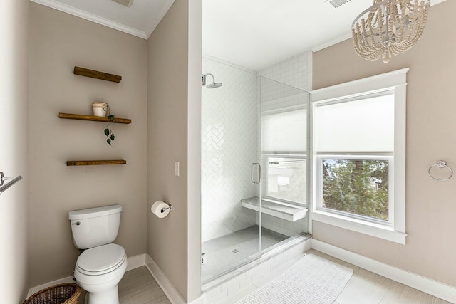 full bathroom with toilet, baseboards, a stall shower, and ornamental molding