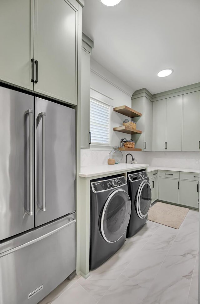 laundry room with marble finish floor and washer and clothes dryer