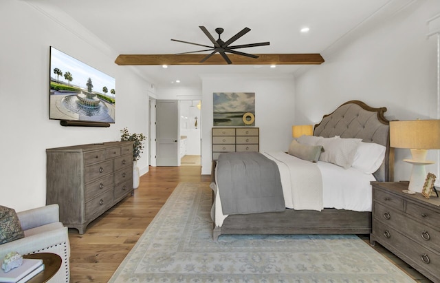bedroom with recessed lighting, beamed ceiling, and wood finished floors