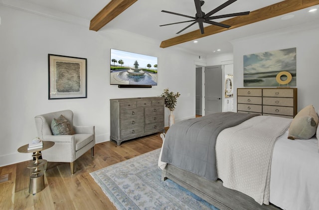 bedroom with baseboards, wood finished floors, recessed lighting, and beamed ceiling