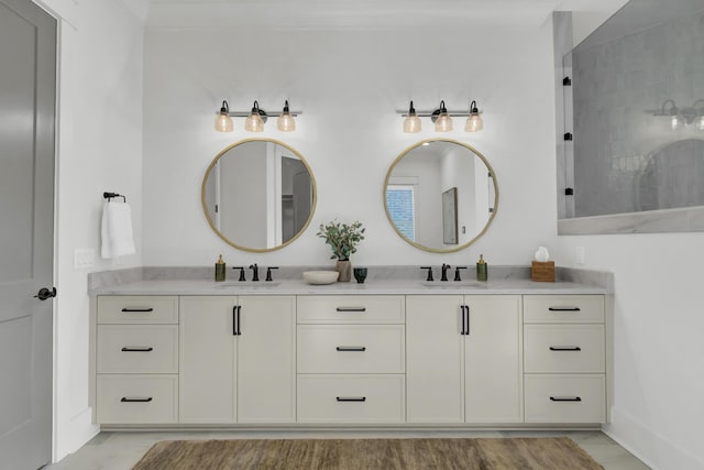 full bath featuring double vanity, a sink, and walk in shower