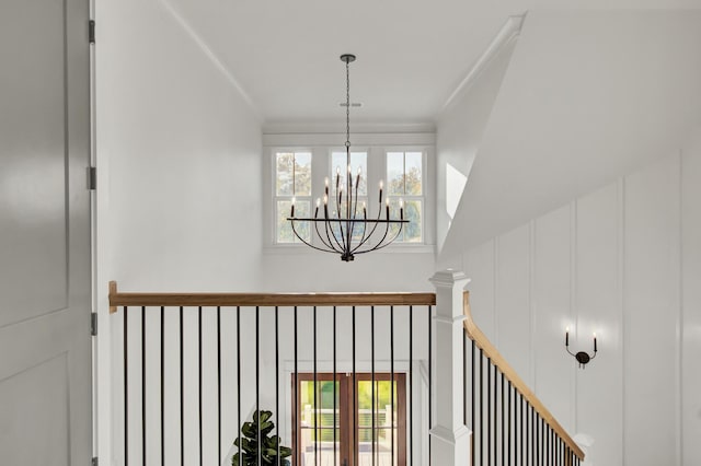 interior details with a notable chandelier and ornamental molding