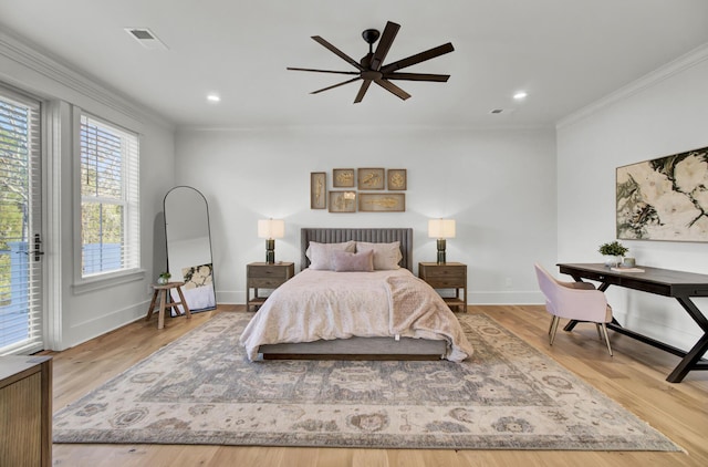 bedroom featuring ornamental molding, baseboards, access to exterior, and wood finished floors