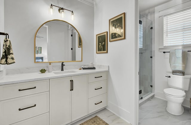 bathroom with baseboards, marble finish floor, toilet, vanity, and a stall shower