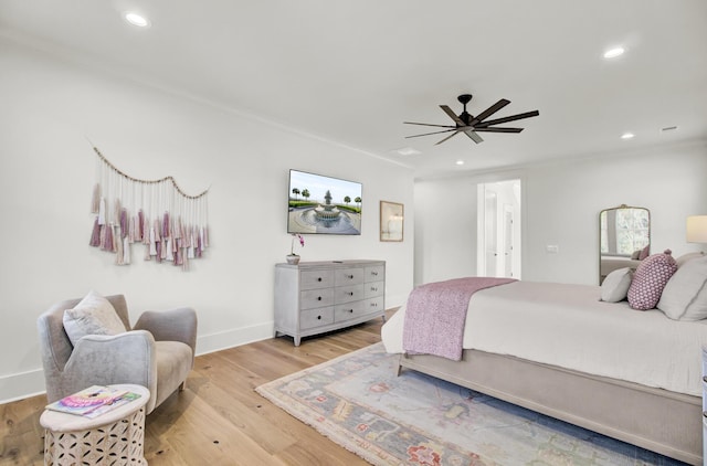 bedroom featuring baseboards, ceiling fan, wood finished floors, and recessed lighting