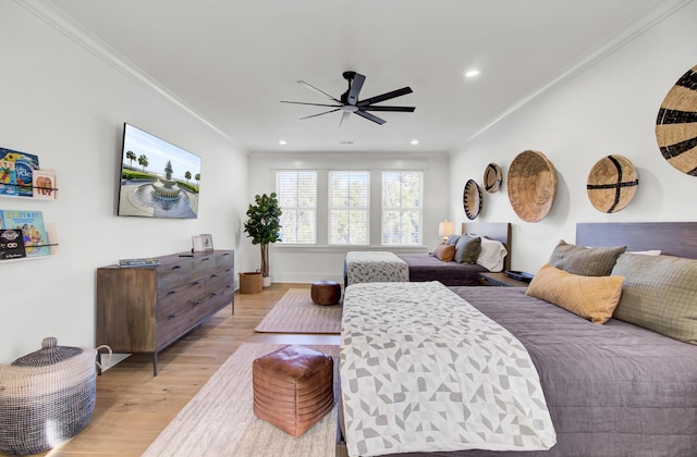 bedroom featuring a ceiling fan, recessed lighting, crown molding, and light wood-type flooring