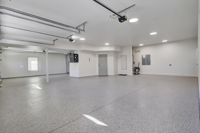 garage with electric panel, baseboards, and a garage door opener