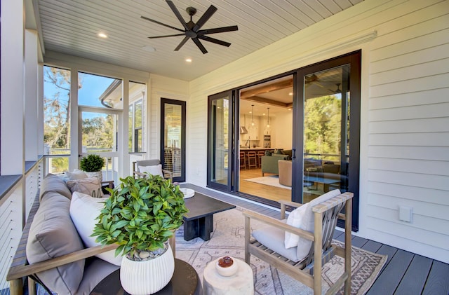 sunroom / solarium with an outdoor hangout area and ceiling fan
