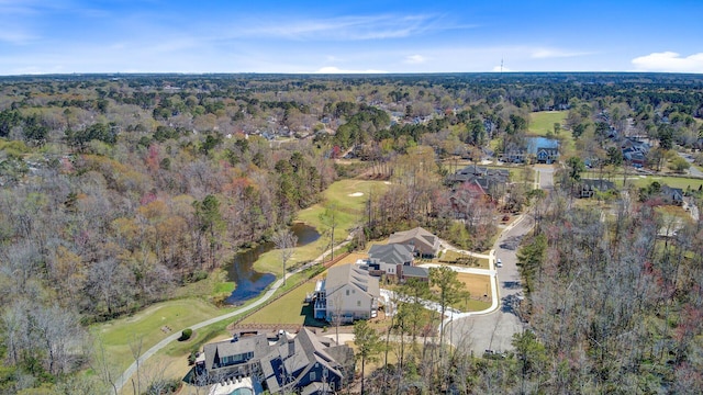 bird's eye view with a wooded view