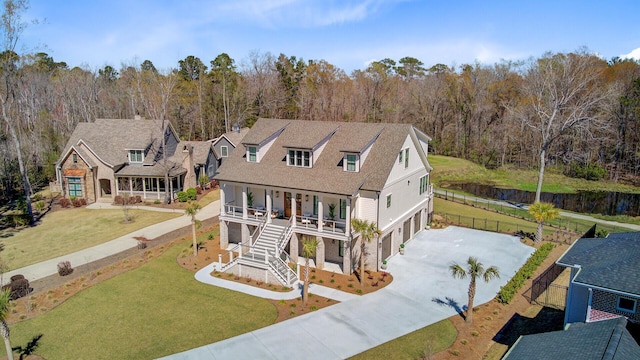 drone / aerial view with a wooded view