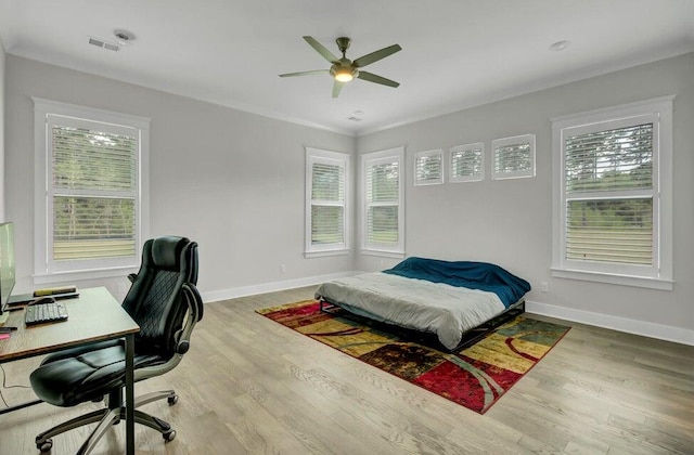 bedroom featuring hardwood / wood-style flooring and ceiling fan