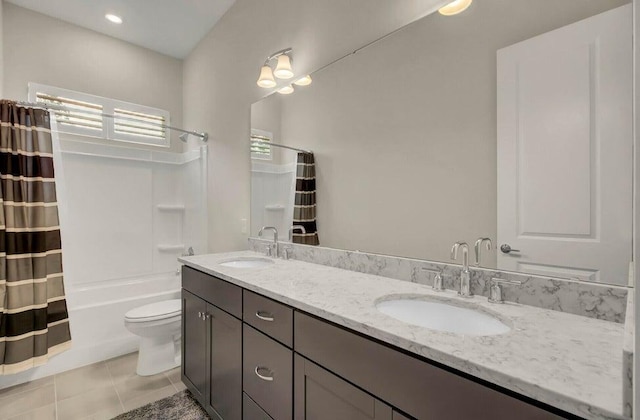 full bathroom featuring vanity, shower / bath combo, tile patterned flooring, and toilet