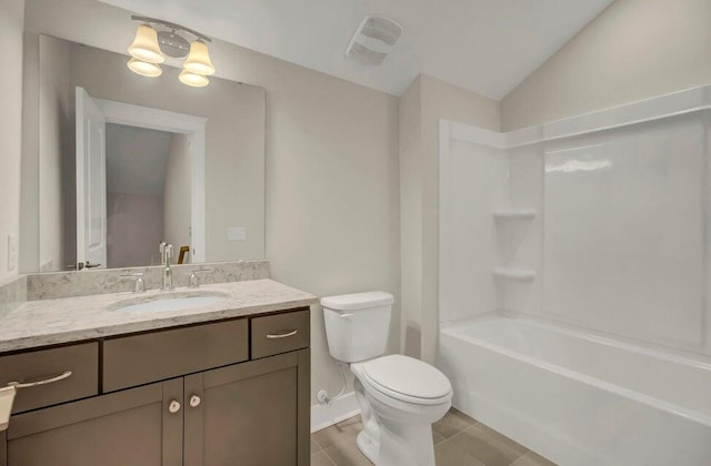 full bathroom with tile patterned flooring, vanity, bathtub / shower combination, lofted ceiling, and toilet