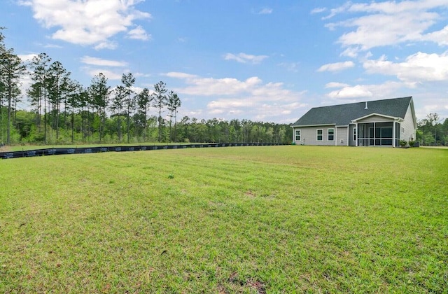 view of yard with a sunroom