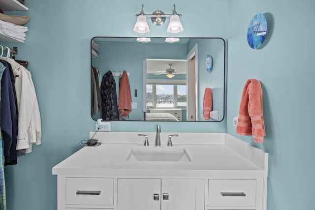 bathroom with ceiling fan and vanity