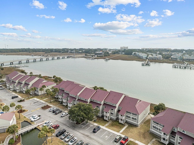 birds eye view of property with a water view