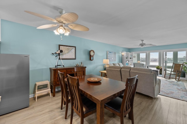 dining space featuring ceiling fan and light hardwood / wood-style floors