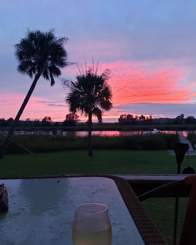 yard at dusk with a patio area