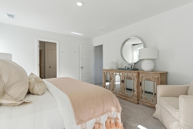 carpeted bedroom with visible vents