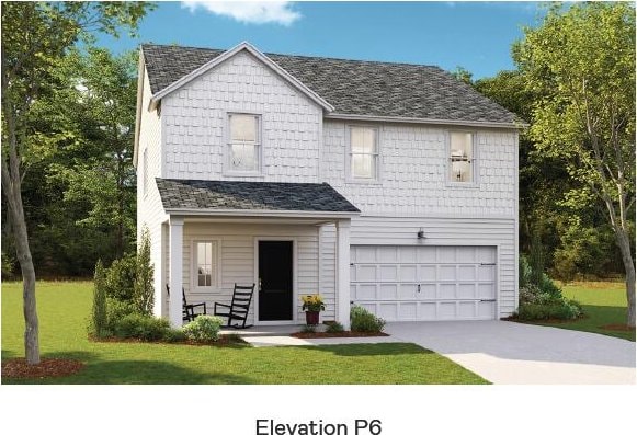 traditional home featuring driveway, an attached garage, covered porch, and a front lawn