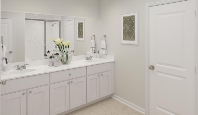 bathroom with double vanity, a shower with shower door, baseboards, and a sink