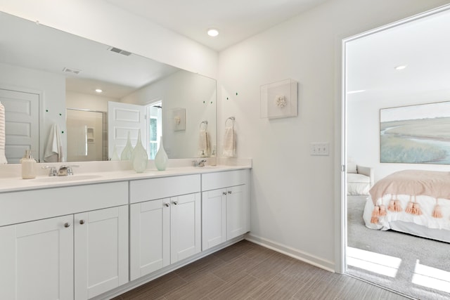 full bath featuring a sink, visible vents, a stall shower, and ensuite bath