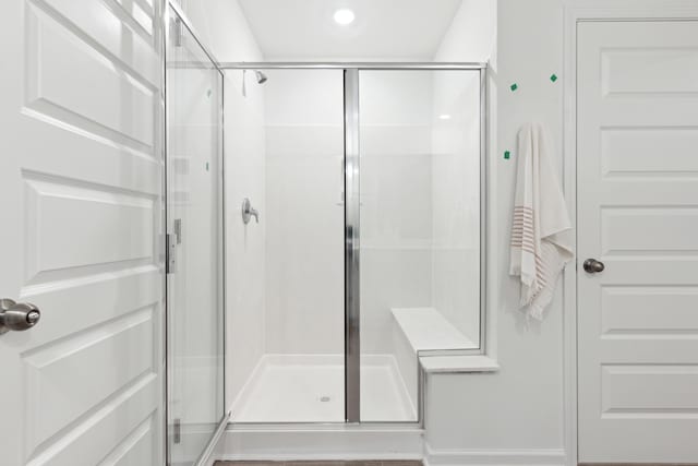 bathroom with a shower stall