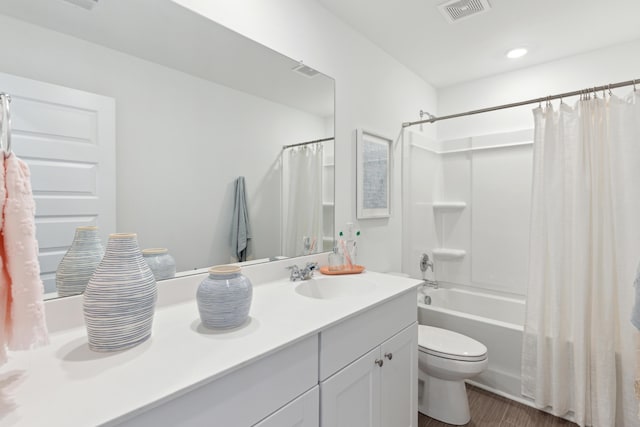 full bathroom with vanity, toilet, visible vents, and shower / tub combo with curtain