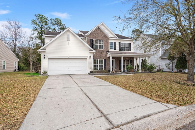 view of front of house featuring brick siding, a porch, an attached garage, driveway, and a front lawn