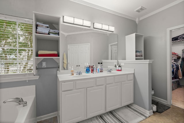 bathroom featuring double vanity, ornamental molding, a walk in closet, and a sink