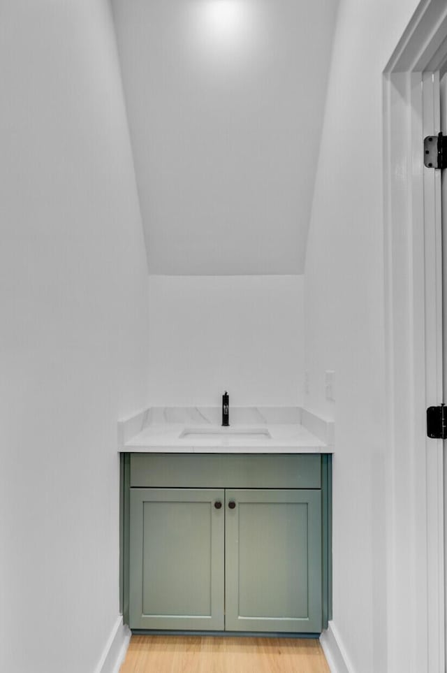 501 Joseph St, Charleston, SC 29412 - bathroom with vaulted ceiling, wood finished floors, and vanity