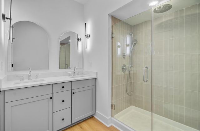 501 Joseph St, Charleston, SC 29412 - full bath with a shower stall, double vanity, and wood finished floors
