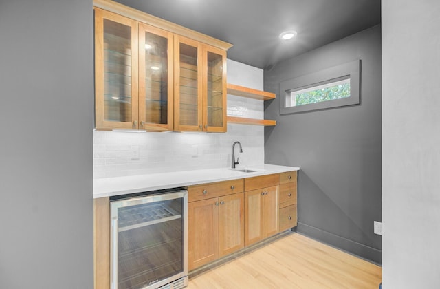 501 Joseph St, Charleston, SC 29412 - indoor wet bar featuring wine cooler, decorative backsplash, and light wood-style floors