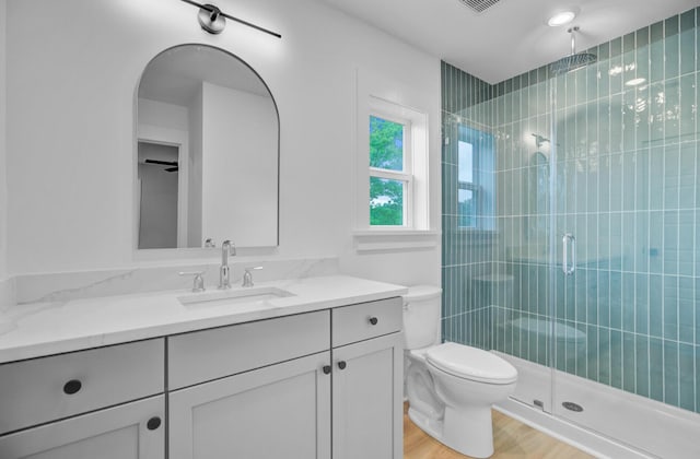 501 Joseph St, Charleston, SC 29412 - bathroom with vanity, a stall shower, and wood finished floors