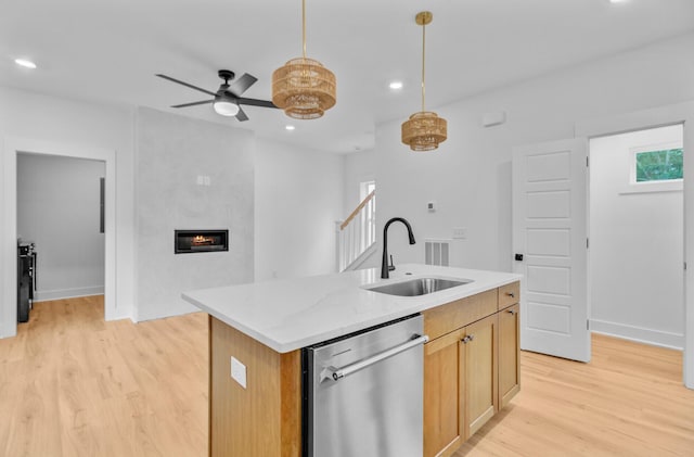 501 Joseph St, Charleston, SC 29412 - kitchen with dishwasher, light wood finished floors, a fireplace, ceiling fan, and hanging light fixtures