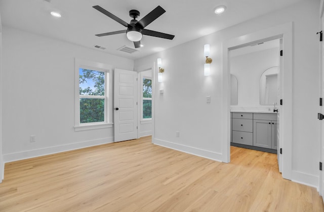 501 Joseph St, Charleston, SC 29412 - unfurnished bedroom featuring light wood finished floors, recessed lighting, and connected bathroom