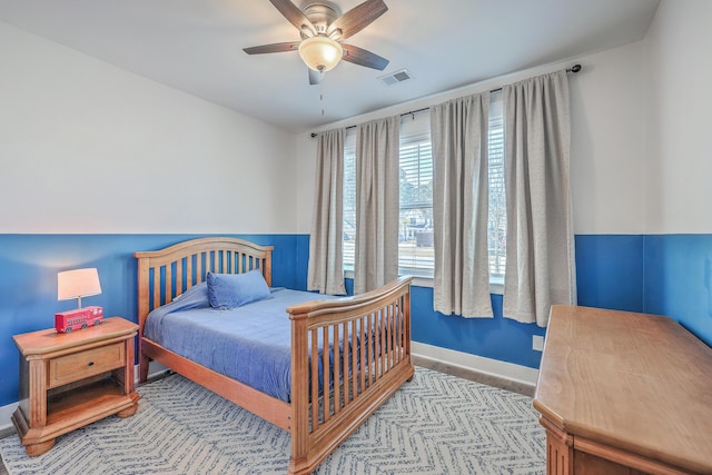 bedroom featuring visible vents, baseboards, and ceiling fan