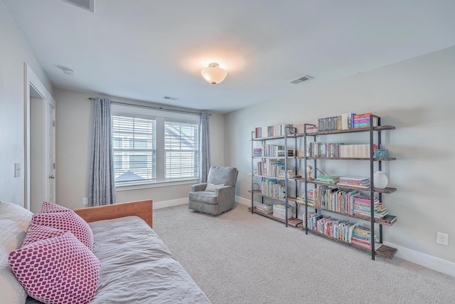 sitting room featuring visible vents, baseboards, and carpet floors