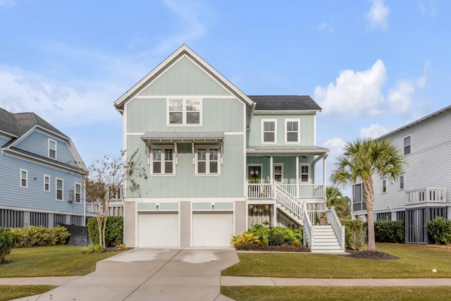 view of front of home featuring a porch, a garage, and a front lawn