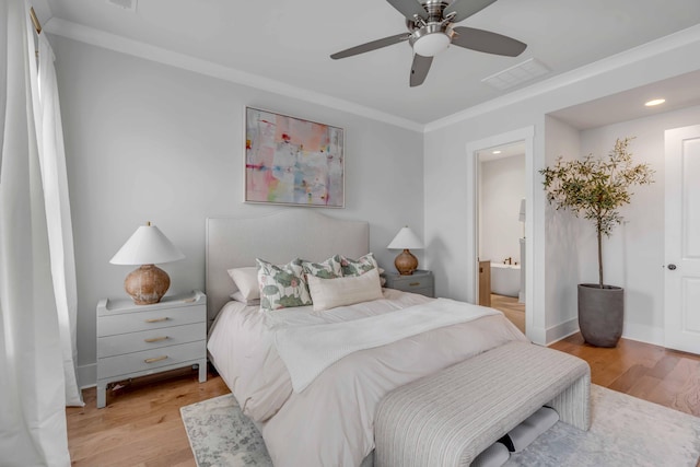 bedroom with ceiling fan, crown molding, ensuite bathroom, and light wood-type flooring