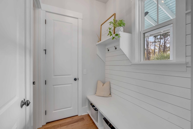 mudroom with light hardwood / wood-style floors