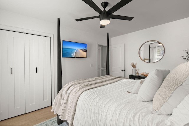 bedroom with light wood-type flooring, a closet, and ceiling fan