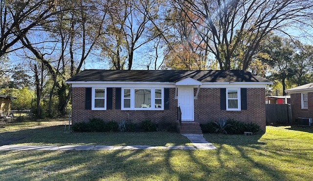 8 Eucalyptus Ave, North Charleston, SC 29418 - ranch-style home featuring central AC unit, fence, a front lawn, entry steps, and brick siding