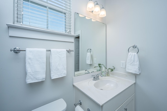 half bath with toilet and vanity