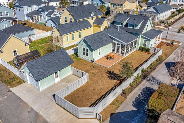 birds eye view of property with a residential view