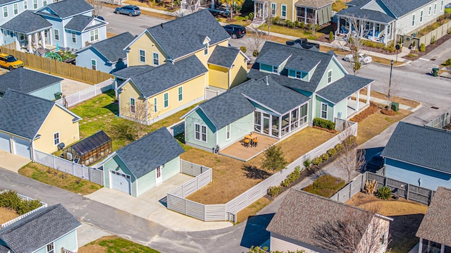 birds eye view of property with a residential view