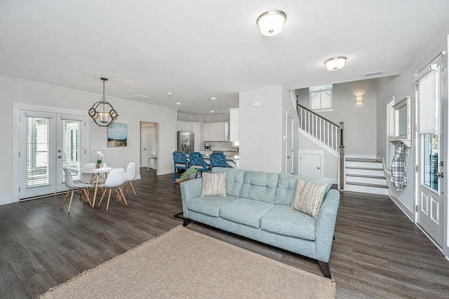 living room with dark wood-style floors, french doors, stairway, and baseboards