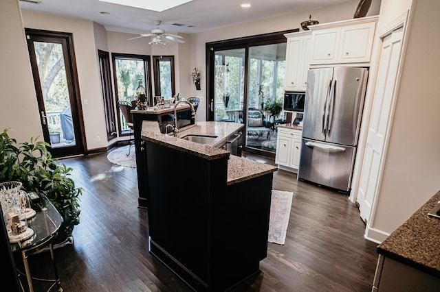 2860 Old Drake Dr, Johns Island, SC 29455 - kitchen with a skylight, stainless steel appliances, sink, a center island with sink, and white cabinetry