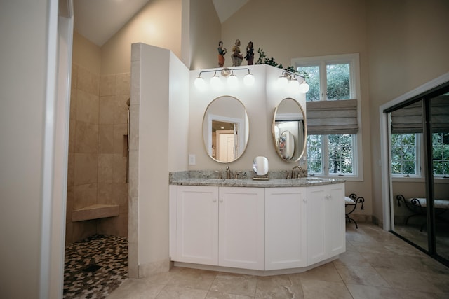 2860 Old Drake Dr, Johns Island, SC 29455 - bathroom with tile patterned floors, vanity, and high vaulted ceiling